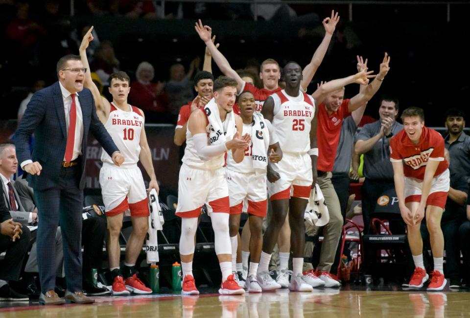 The Bradley bench celebrates a three-pointer against Eastern Michigan  in the second half Tuesday, Nov. 15, 2022 at the Peoria Civic Center. The Braves devastated the Eagles 89-61.