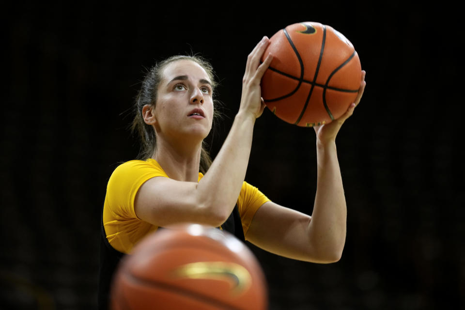 Iowa guard Caitlin Clark looks to shoot during Iowa's NCAA college basketball media day Oct. 4, 2023, in Iowa City, Iowa. Clark is embracing her role as an ambassador for the game after she led Iowa to the NCAA championship game last season. She enters this season with 90 straight double-figure scoring games and a 27.3-point career average. (AP Photo/Charlie Neibergall)