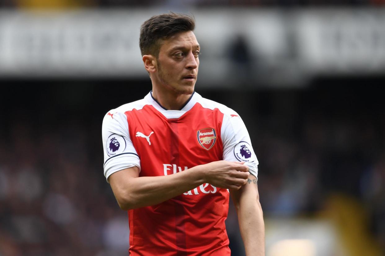 Frustrated: Mesut Ozil during the defeat at White Hart Lane: Stuart MacFarlane/Arsenal FC via Getty Images