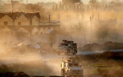 US army vehicles supporting the Syrian Democratic Forces in Hajin, in the Deir Ezzor province, eastern Syria, December 15, 2018. - Credit: DELIL SOULEIMAN/AFP