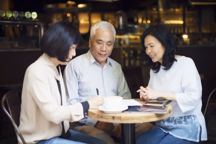 A senior couple signing a medical power of attorney in Texas.