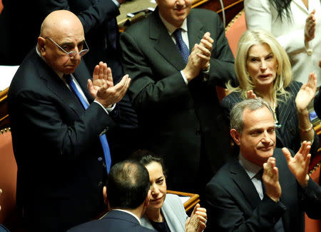 Senator Adriano Galliani applauses the new elected Senate president Forza Italia party's Maria Elisabetta Alberti Casellati during the second session day since the March 4 national election in Rome, Italy March 24, 2018. REUTERS/Remo Casilli