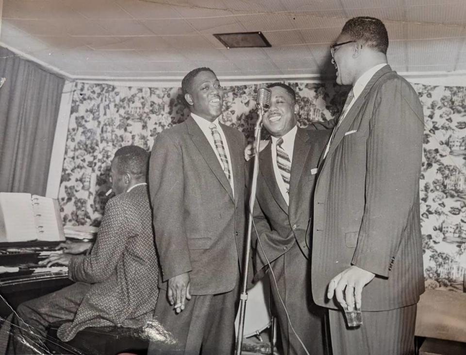 Jimmie McKee, center, sings with J. Arthur Twitty, left, and Chippy Chase, right, at Excelsior Club in Charlotte, while Robert Graham plays piano.