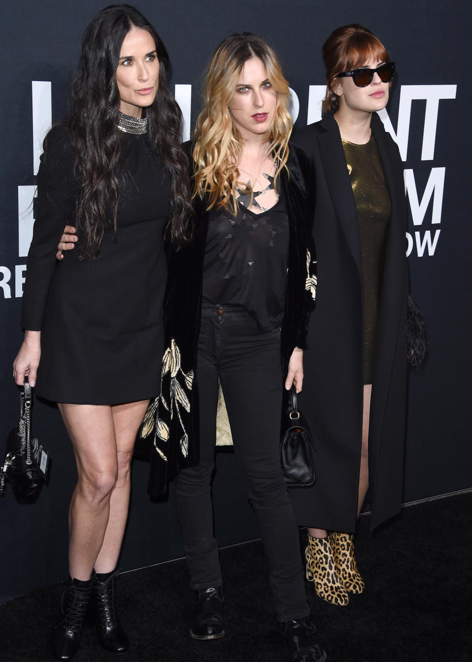 <p>Thanks to their matching all black outfits and very similar bone structures, the trio look more like sisters than mom-and-daughters at the <em>Saint Laurent</em> premiere in L.A.</p>