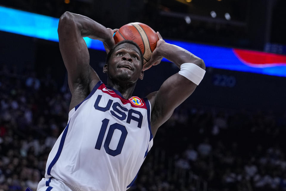 U.S. guard Anthony Edwards (10) gets a dunk against Lithuania during the second half of a Basketball World Cup second-round match in Manila, Philippines Sunday, Sept. 3, 2023.(AP Photo/Michael Conroy)