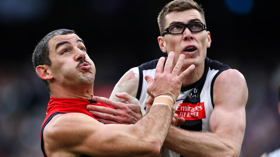 Mason Cox contests the ruck against Taylor Walker.