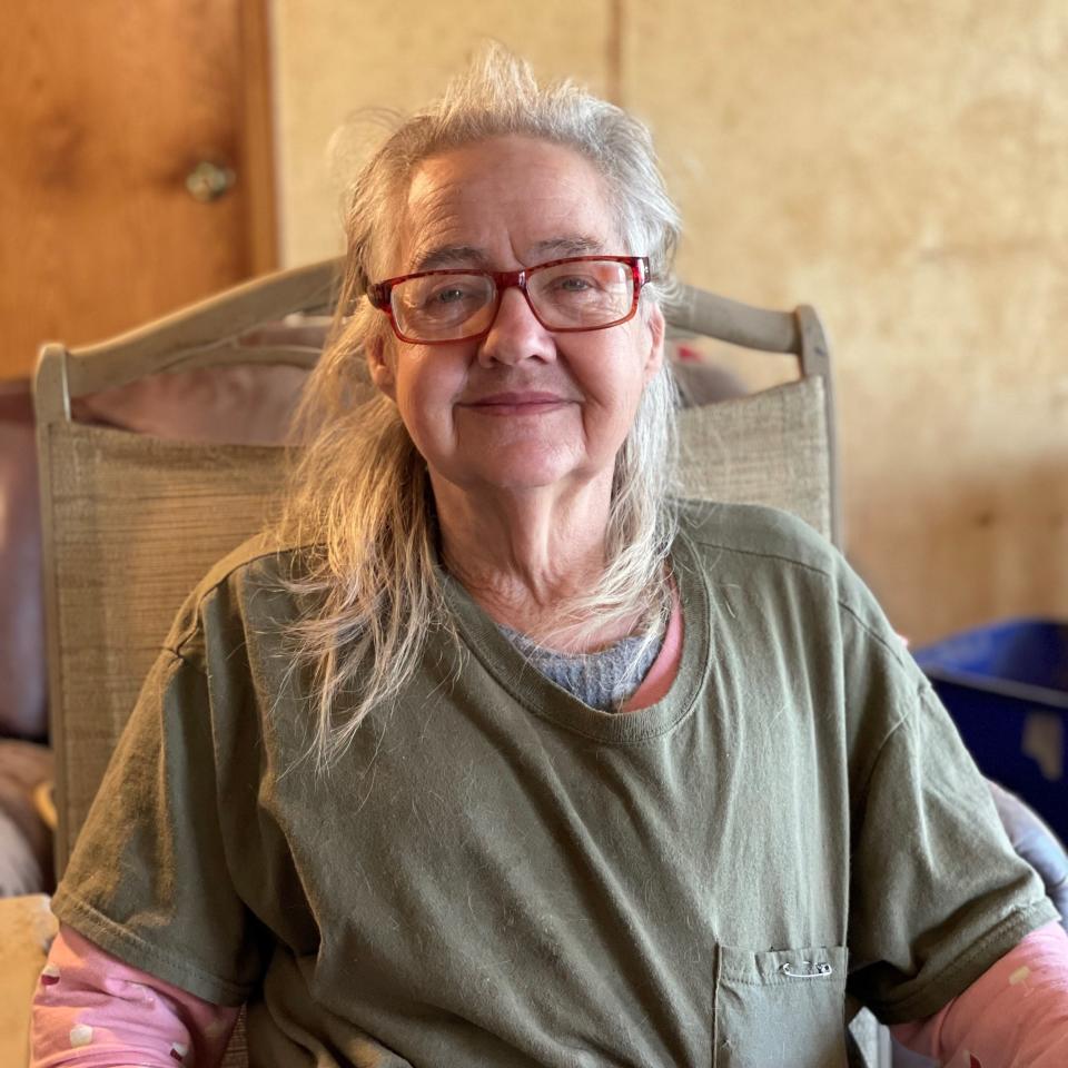 Sylvia Wolfe smiles for the camera from inside her home. Cleaning, renovating and rehabilitating the house has taken nearly two full years.