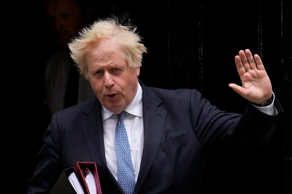 The report found that Boris Johnson repeatedly violated the law with his Partygate denials  (AP)