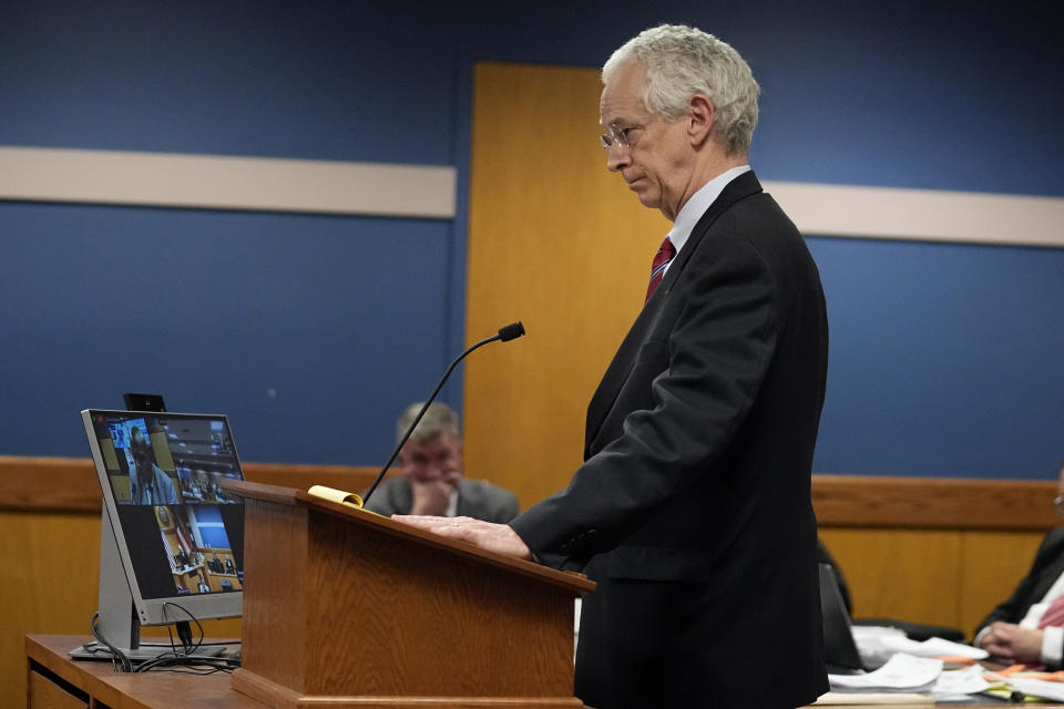 Attorney Harry MacDougald, representing defendant Jeffrey Clark, questions witness Terrence Bradley during a hearing in court Tuesday, Feb. 27, 2024, in Atlanta. Bradley, special prosecutor Nathan Wade’s former law partner and onetime divorce attorney, testified as a judge considered an effort by lawyers for former President Donald Trump to disqualify Fulton County District Attorney Fani Willis over her romantic relationship with Wade. (AP Photo/Brynn Anderson, Pool)