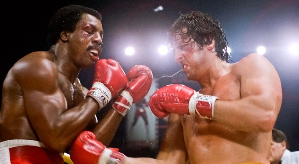 USA. Sylvester Stallone and Carl Weathers  in a scene from (C)United Artists  film: Rocky II (1979). Plot: Rocky struggles in family life after his bout with Apollo Creed, while the embarrassed champ insistently goads him to accept a challenge for a rematch.  Ref:  LMK110-J7059-230421 Supplied by LMKMEDIA. Editorial Only. Landmark Media is not the copyright owner of these Film or TV stills but provides a service only for recognised Media outlets. pictures@lmkmedia.com