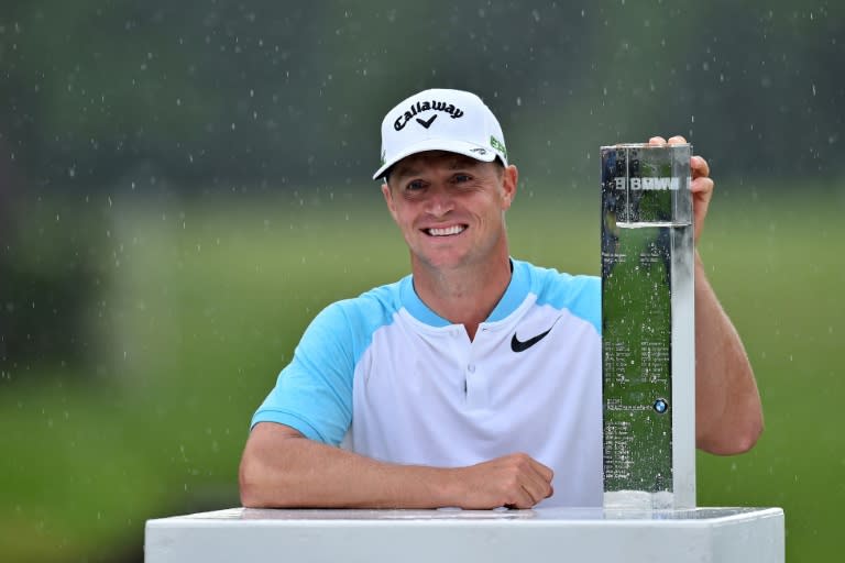 Sweden's Alex Noren poses with the trophy after winning the BMW PGA Championship, at Wentworth Golf Club in in Surrey, south-west of London, on May 28, 2017