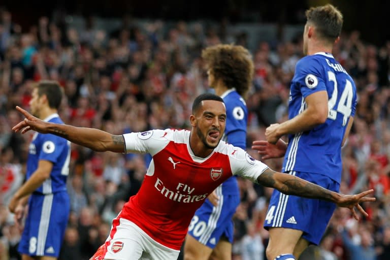 Arsenal's Theo Walcott celebrates scoring a goal during their English Premier League match against Chelsea, at The Emirates stadium in London, on September 24, 2016