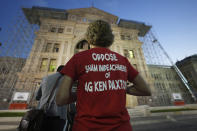 Jane Ane Sellars of Frisco, Texas, stands in line up outside the Texas State Capital waiting for doors to open in Austin, Tuesday, Sept. 5, 2023. The historic impeachment trial of Texas Attorney General Ken Paxton begins today and will determine whether the embattled Republican, who is an ally of former President Donald Trump, is ousted from office after years of scandal and corruption accusations. (AP Photo/LM Otero)