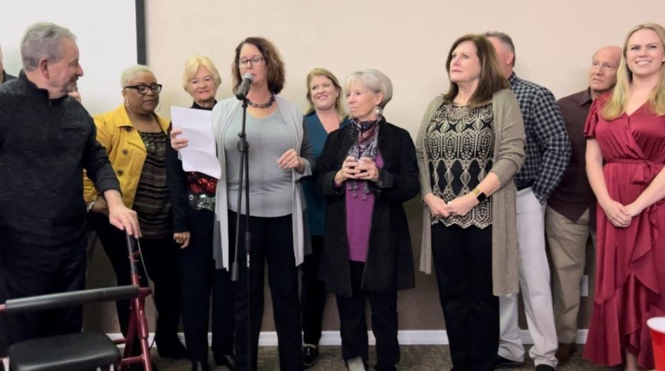 Kimberly Dillon, board chair of the Port Orange South Daytona Chamber of Commerce, gives a speech thanking Debbie Connors, front row second from right, for her 22 years of service as the chamber's CEO at Connors' retirement party Wednesday night, Dec. 21, 2022.