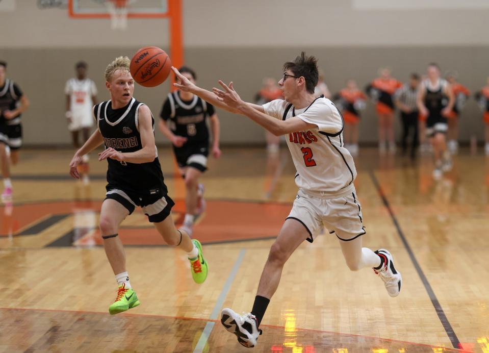 Tyrus LaRocca of Summerfield passes as Shamus Alcock gives chase during a 66-27 Summerfield romp Wednesday night.