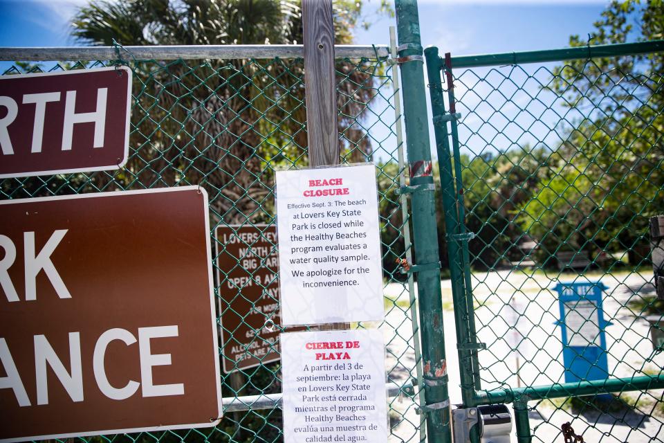 Closed beach signs are seen at the two entrances to Lovers Key on Tuesday, Sept. 6, 2022. The beach was closed temporarily on Sept. 3 while the Healthy Beaches program evaluated a water quality sample. It is unknown what has caused the beach to close.