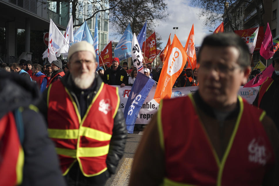 Demonstrators of the CGT 69 Department Union take part to a protest march against plans to push back France's retirement age, in Lyon, central France, Tuesday, Jan. 31, 2023. Labor unions aimed to mobilize more than 1 million demonstrators in what one veteran left-wing leader described as a "citizens' insurrection." The nationwide strikes and protests were a crucial test both for President Emmanuel Macron's government and its opponents. (AP Photo/Laurent Cipriani)