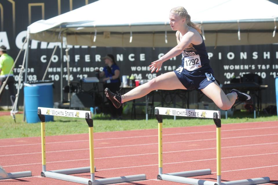 Sacred Heart's Lauryn Mikkelson clears a hurdle during the 300-meter hurdle prelims of the Class 2A state track and field championships Friday, May 27, 2022 at Cessna Stadium in Wichita.