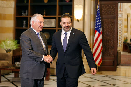 Lebanon's Prime Minister Saad al-Hariri shakes hands with U.S. Secretary of State Rex Tillerson at the governmental palace in Beirut, Lebanon, February 15, 2018. REUTERS/Jamal Saidi