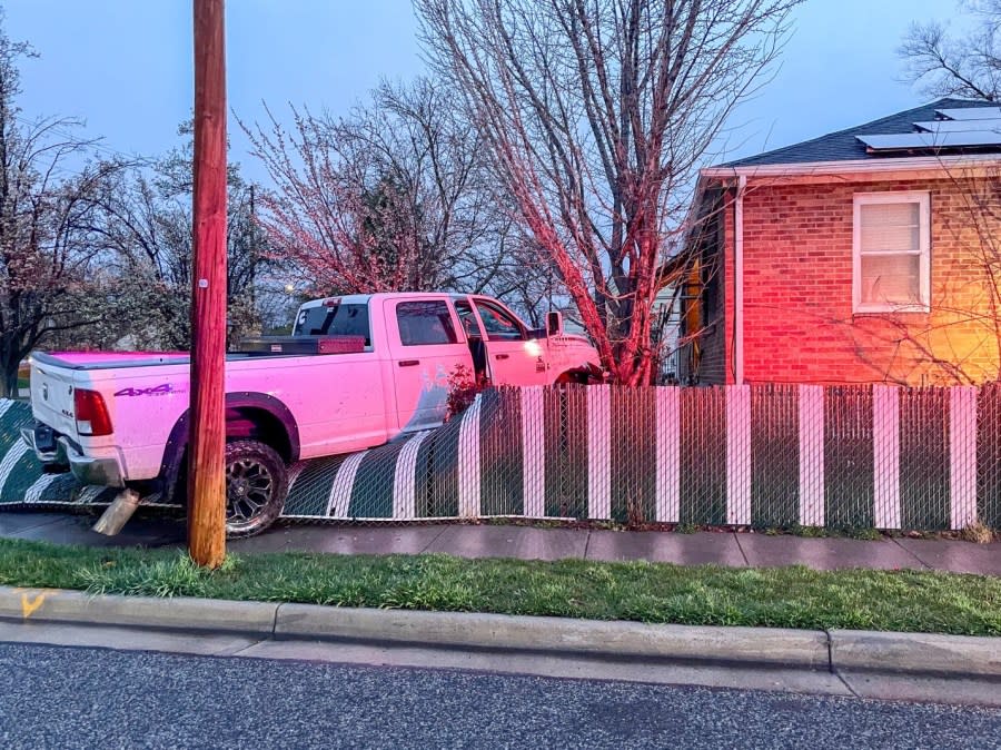 A white truck crashed into the yard of a home in the Glendale neighborhood (SLCPD photo, March 31, 2024)