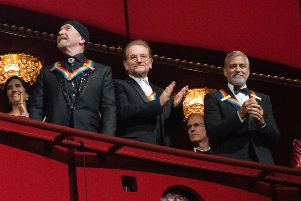 The Edge, left, and Bono and George Clooney during a performance at the 45th Kennedy Center Honors in 2022. U2 was among the honorees.