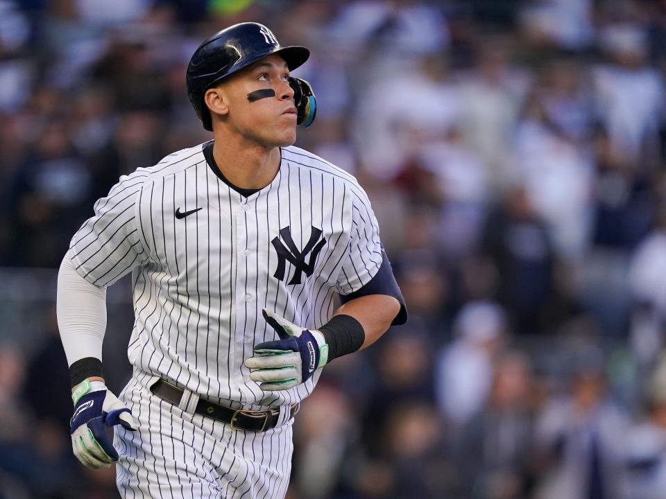 Aaron Judge watches a home run leave the park against the Cleveland Guardians.