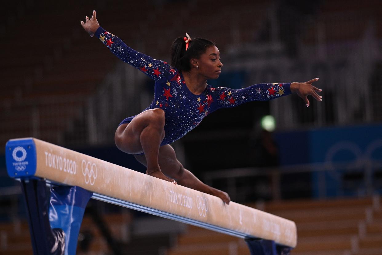 USA's Simone Biles competes in the artistic gymnastics balance beam event of the women's qualification during the Tokyo 2020 Olympic Games at the Ariake Gymnastics Centre in Tokyo on July 25, 2021.