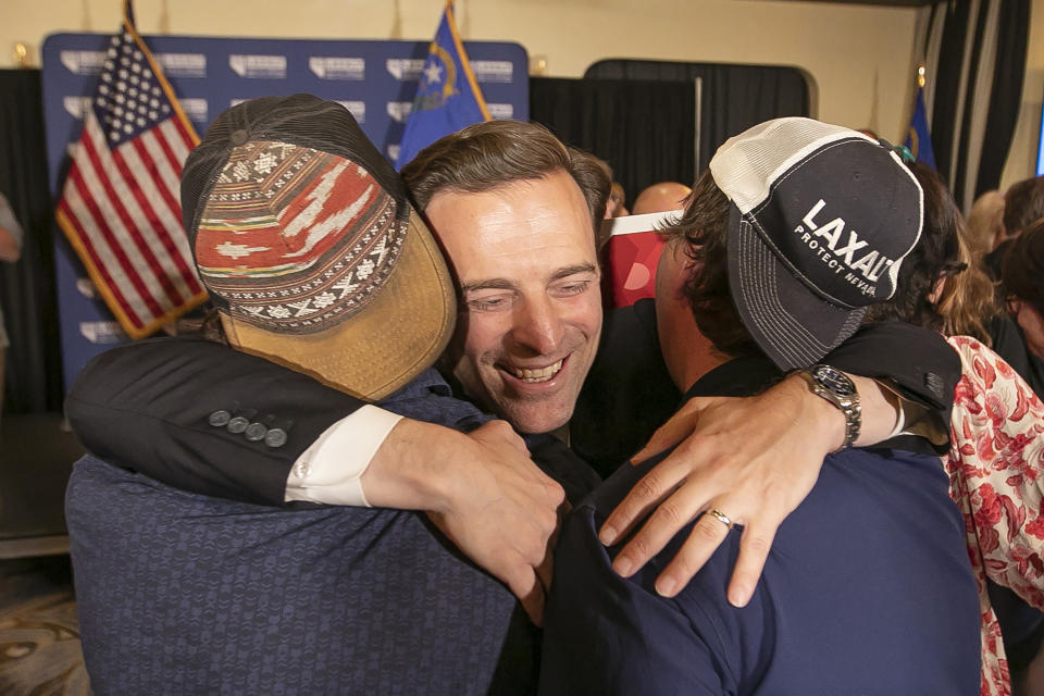 Nevada Republican U.S. Senate candidate Adam Laxalt celebrates his victory with family, friends and supporters at the Tamarack Casino in Reno, Nev., Tuesday, June 14, 2022. (AP Photo/Tom R. Smedes)
