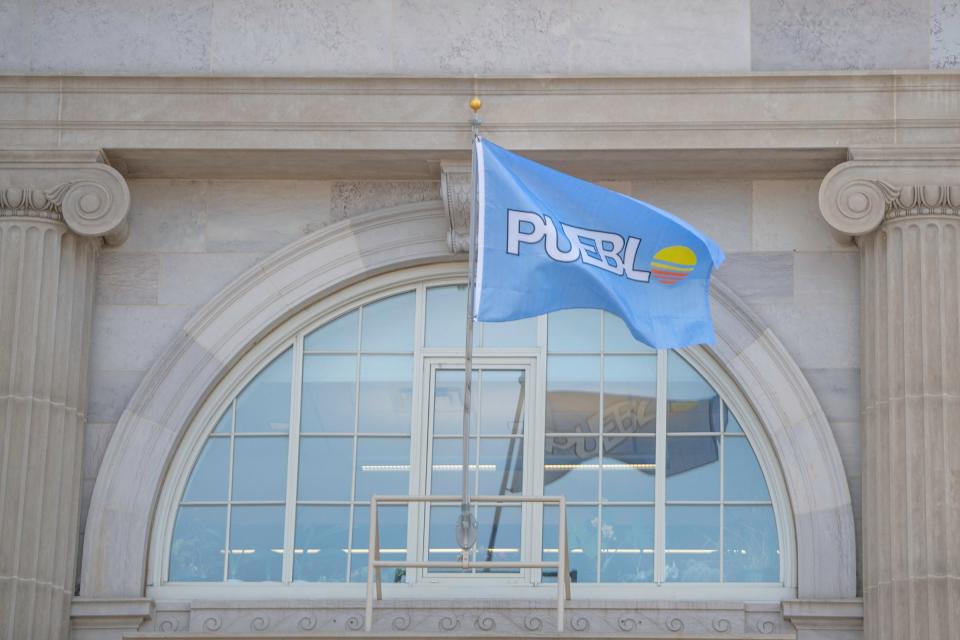A Pueblo flag waves in the wind at the front of Pueblo City Hall on Friday, March 22, 2024.