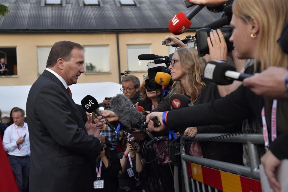 Swedish Prime Minister Stefan Lofven talks to media in Stockholm, Sweden, Sunday Sept. 9, 2018. Polls have opened in Sweden's general election in what is expected to be one of the most unpredictable and thrilling political races in Scandinavian country for decades amid heated discussion around top issue immigration. (Jonas Ekstromer/TT via AP)