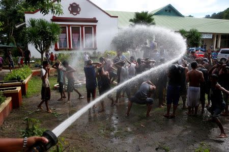 Drug users who call themselves "Recovering Champions" are hosed with water as part of their weekend drug rehabilitation program organised by the government of San Fernando, La Union, in northern Philippines, September 24, 2016. REUTERS/Erik De Castro/File Photo