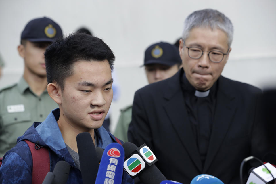 Chan Tong-kai, left, talks to the media as he is released from prison in Hong Kong Wednesday, Oct. 23, 2019. A murder suspect whose case indirectly led to Hong Kong's ongoing protests was freed from prison on Wednesday and told reporters he was willing to surrender to authorities in Taiwan, where he is wanted for the killing of his girlfriend. (AP Photo/Mark Schiefelbein)