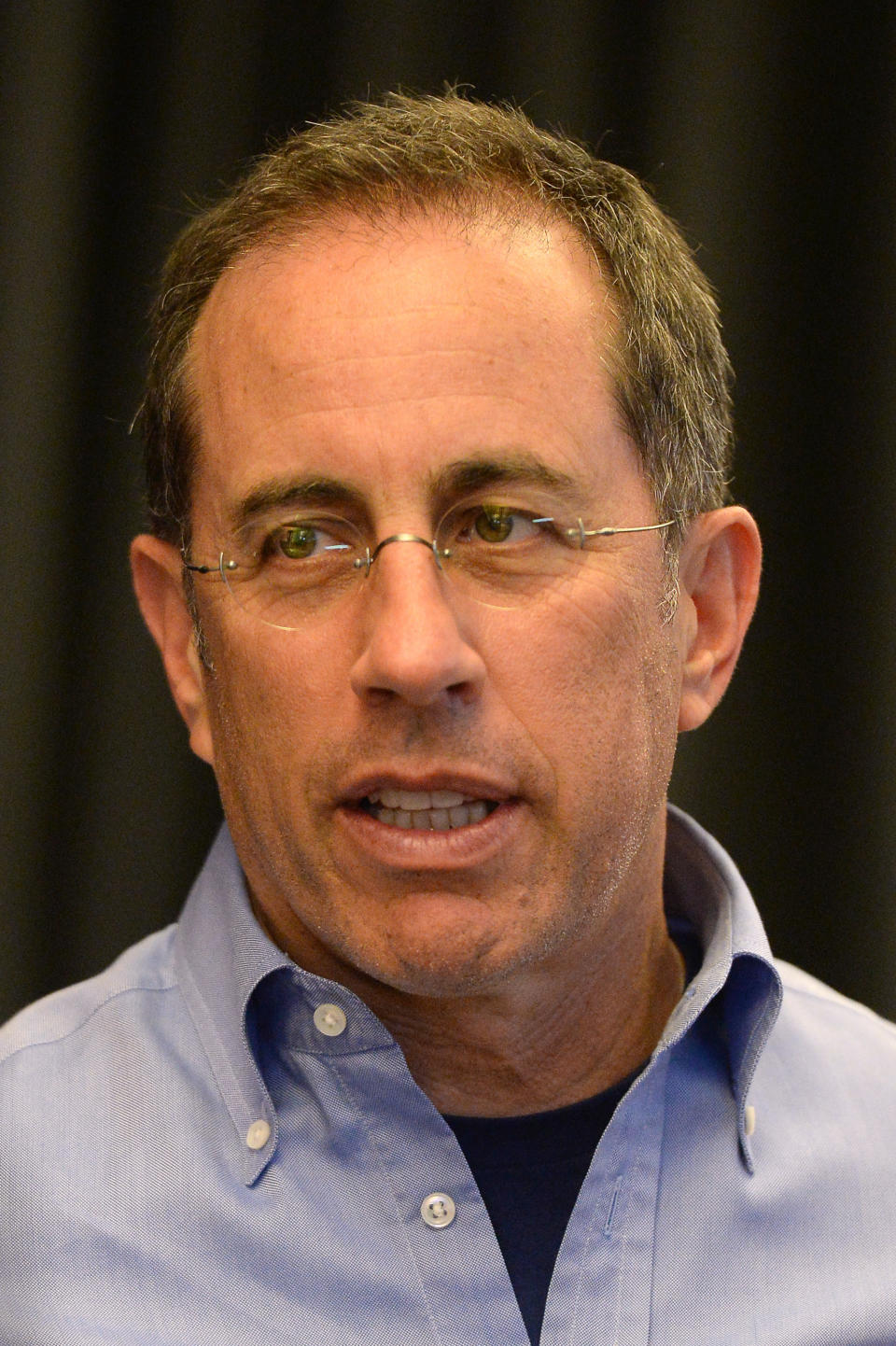 A close-up of Jerry Seinfeld wearing eyeglasses