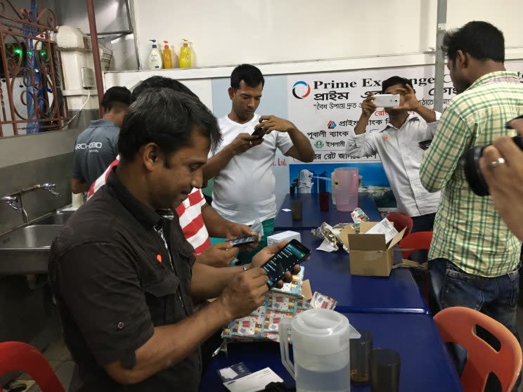 About 50 3G phones were distributed to foreign workers by TWC2 on Tuesday (21 March) evening. (PHOTO: Nicholas Yong)