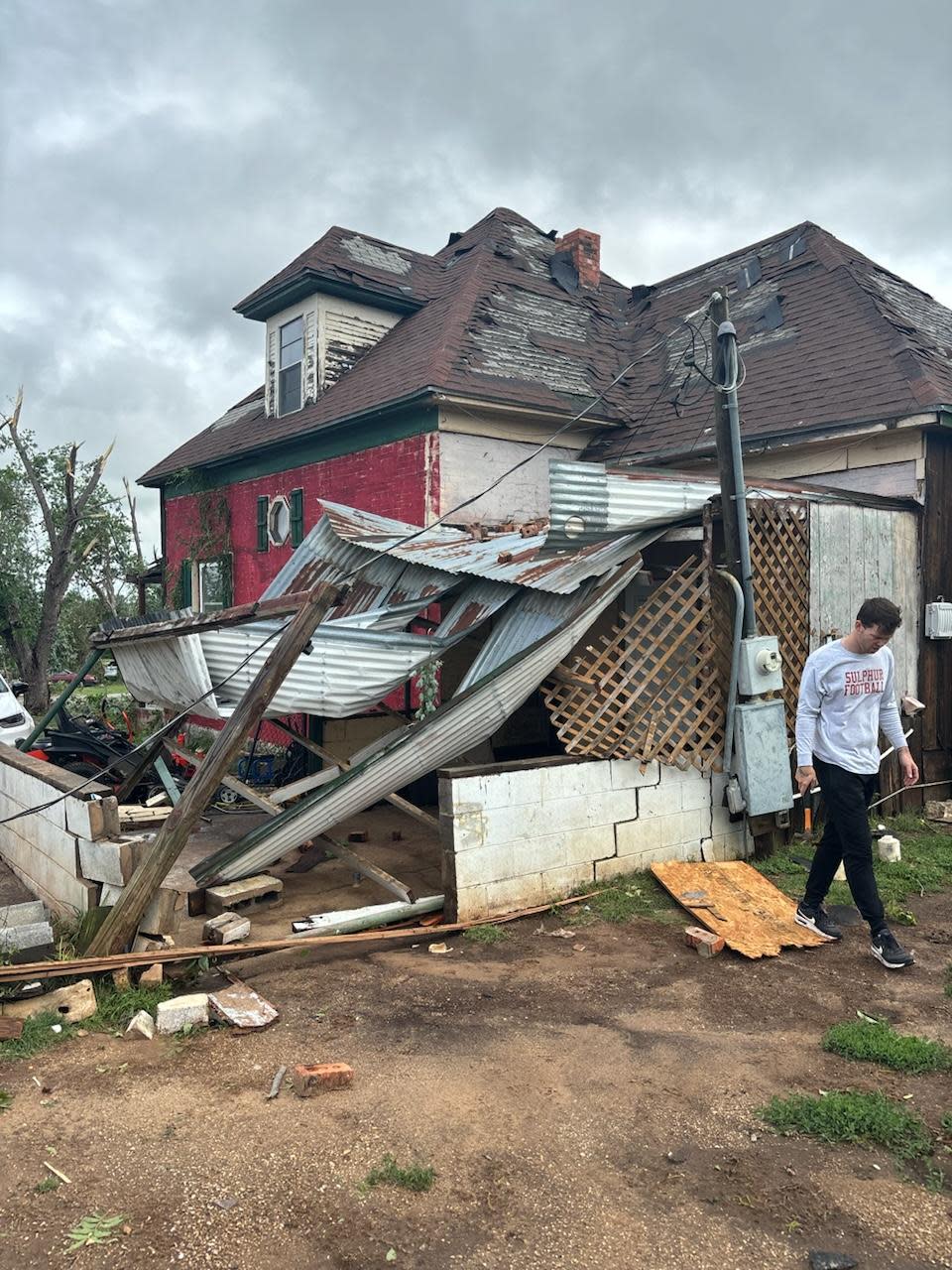 Tornado damage is shown around Waylon Wyche's home in Sulphur.