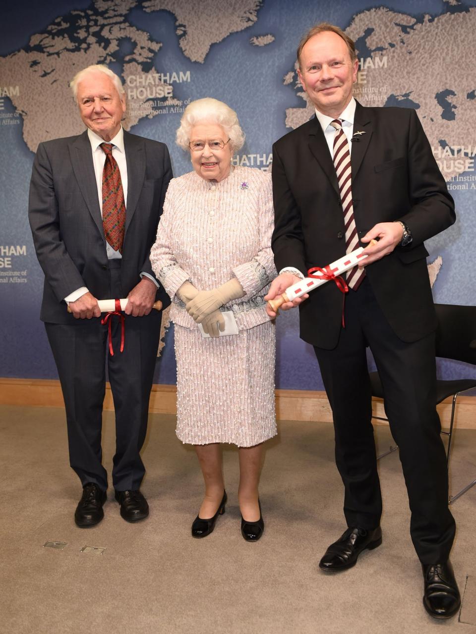 The Queen presents the Chatham House Prize to Sir David Attenborough and head of the BBC's Natural History Unit, Julian Hector (POOL/AFP via Getty Images)