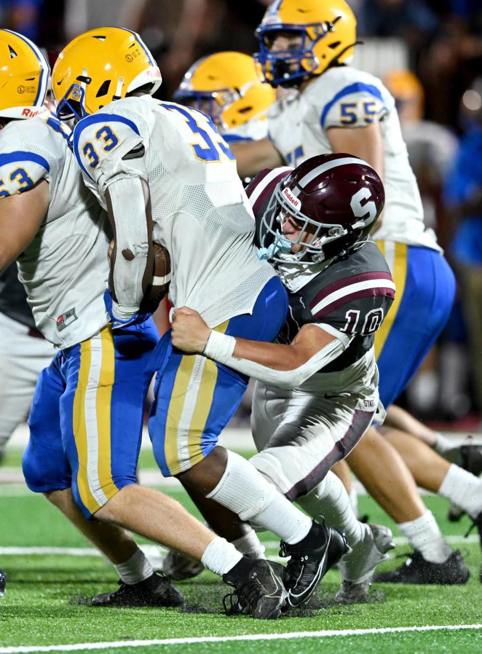 State College’s Michael Gaul stops Downingtown East’s Ayden Harris during the game on Friday, Sept. 1, 2023.