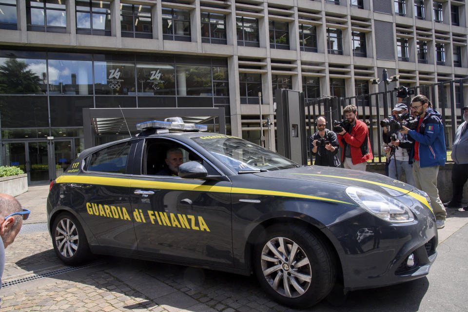 A financial police car is parked outside the headquarters of the Milan-Cortina 2026 Winter Olympics local organizing committee in Milan, Italy, Tuesday, May 21, 2024. Italy’s financial police have raided the headquarters of the Milan-Cortina 2026 Winter Olympics local organizing committee as part of an investigation into alleged irregularities over the way digital sponsors for the games were selected. Milan prosecutors say “the checks underway are aimed at procedures used for the selection of technological providers and sponsors as well as the hiring of employees by the foundation." (Claudio Furlan/LaPresse via AP)