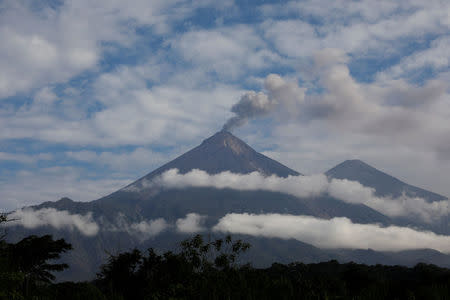 FILE PHOTO: The Fuego volcano spews smoke and ash as seen from San Miguel Los Lotes in Escuintla, Guatemala June 12, 2018. REUTERS/Carlos Jasso/File Photo