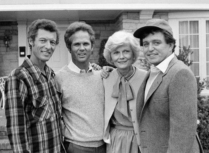 FILE - Members of the original cast of the "Leave It To Beaver" television series pause during filming of an upcoming TV special, "Still The Beaver," in Los Angeles, Dec. 10, 1982. From left to right are Ken Osmond, Tony Dow, Babara Billingsley and Jerry Mathers. Dow has died at age 77. Frank Bilotta, who represented Dow in his work as a sculptor, confirmed his death in an email to The Associated Press on Wednesday, July 27, 2022. (AP Photo/Wally Fong, File)