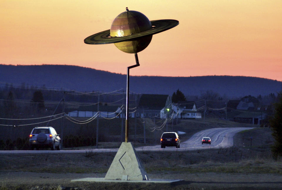 FILE - A model of the planet Saturn stands near Route 1 in Westfield, Maine, Friday, May 9, 2003. The nation's largest three-dimensional scale model of the solar system is positioned along a 40-mile stretch of highway between Presque Isle, Maine, and Houlton, Maine. The April 8, 2024 total solar eclipse in North America first hits land at Mexico’s Pacific coast, cuts diagonally across the U.S. from Texas to Maine and exits in eastern Canada. (AP Photo/Robert F. Bukaty, File)