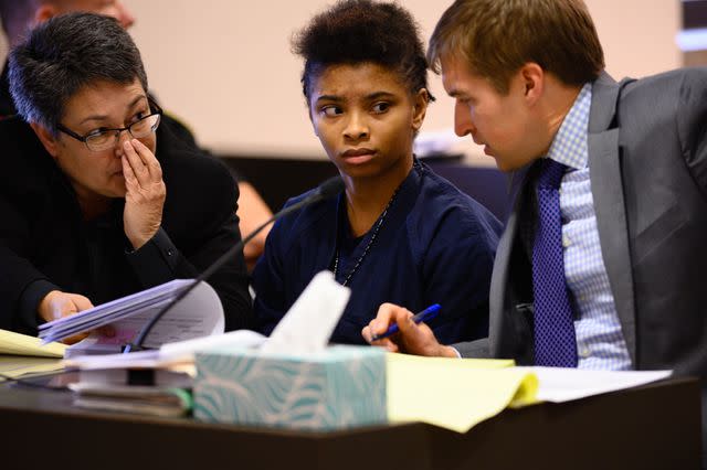 <p>Sarah L. Voisin/The Washington Post via Getty</p> Chrystul Kizer with her legal team at a hearing in the Kenosha County Courthouse on November 15, 2019.