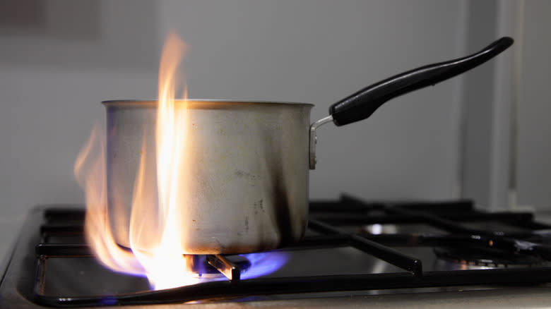 pan on gas stove with big flame