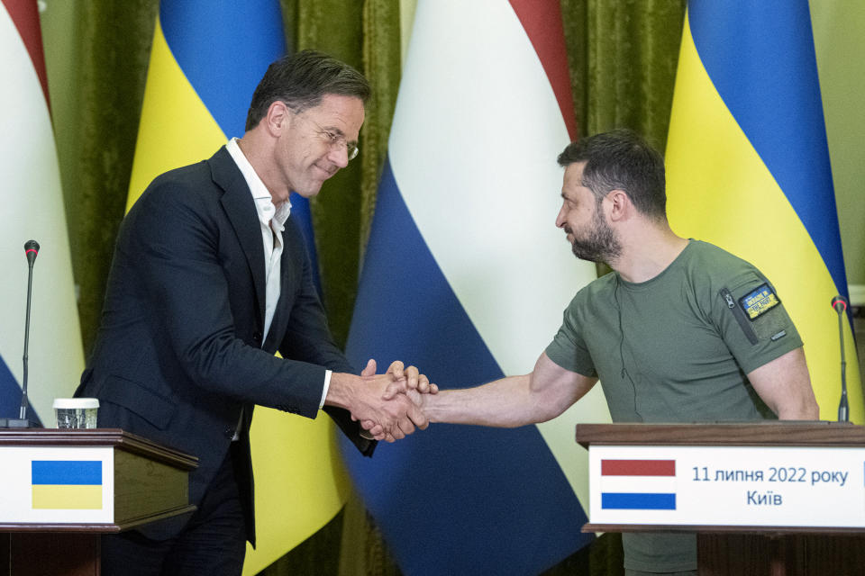 President of Ukraine Volodymyr Zelenskyy, right, shakes hands with Prime Minister of the Netherlands Mark Rutte during their joint press conference following their meeting in Kyiv, Ukraine, Monday, July 11, 2022. (AP Photo/Andrew Kravchenko)