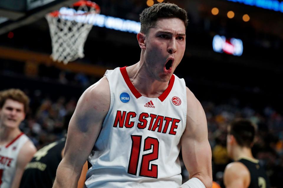 North Carolina State guard Michael O'Connell (12) celebrates after making a basket and being fouled during the second half in the second round of the 2024 NCAA Tournament at PPG Paints Arena.