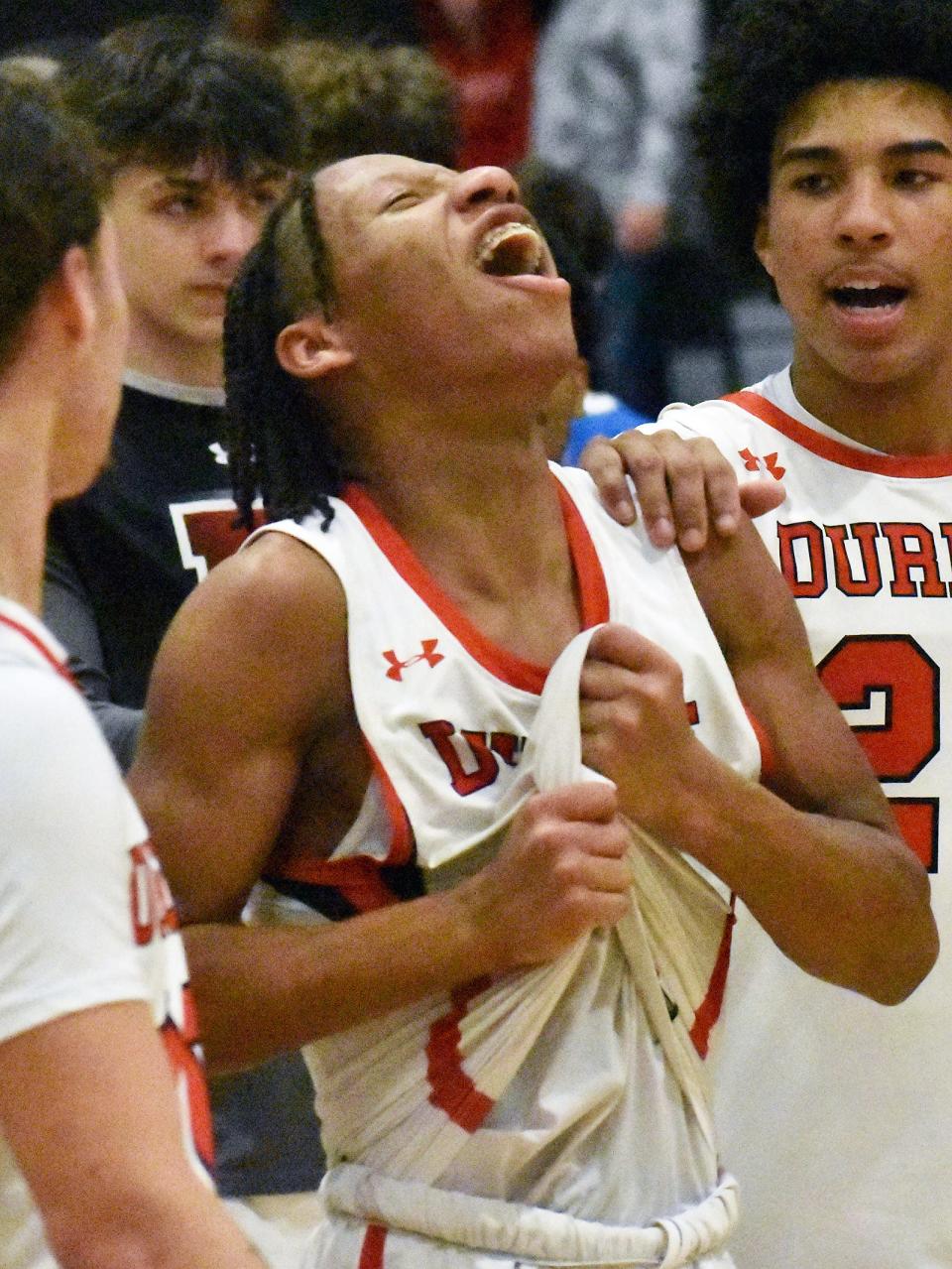 Durfee's Jahmier Stephenson celebrates after scoring his 1,000th career point during Friday's non-league contest at B.M.C. Durfee High School Feb. 16, 2024.
