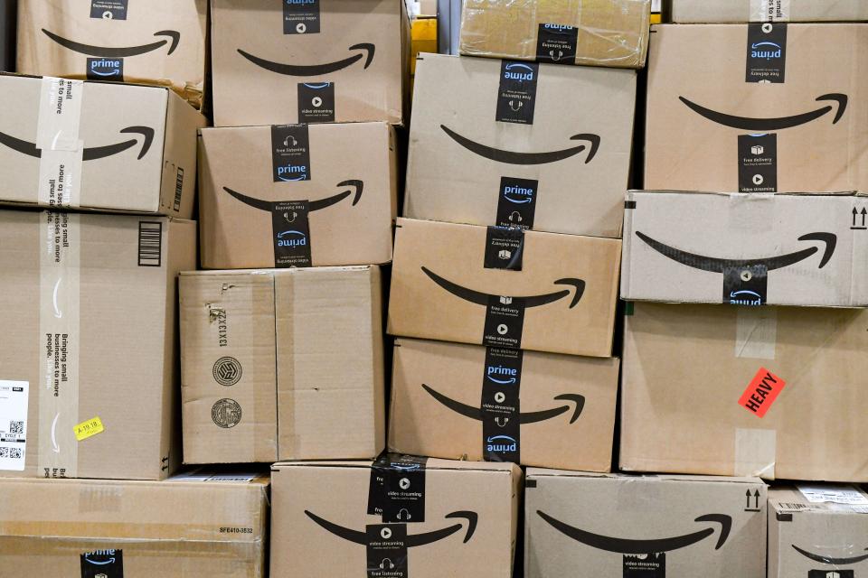 Amazon packages are stacked on a cart on Tuesday, March 29, 2022, at the Amazon Delivery Station in Sioux Falls.