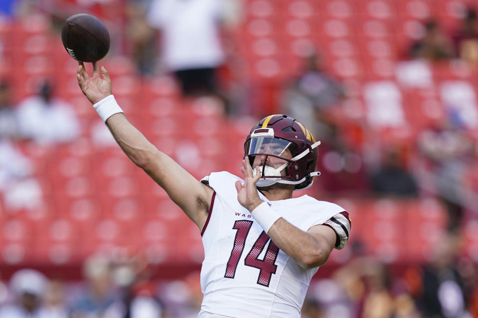 Washington Commanders quarterback Sam Howell (14) throws the ball before the start of an NFL preseason football game against the Cincinnati Bengals, Saturday, Aug. 26, 2023, in Landover, Md. (AP Photo/Stephanie Scarbrough)