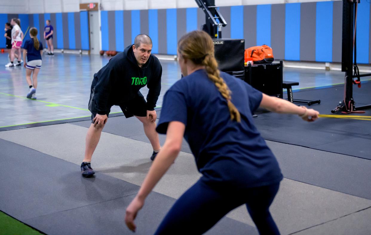 Trainer and owner of Torq Fitness & Performance Kyle Piraino works with Peoria Notre Dame basketball player Kaitlyn Cassidy at his East Peoria facility.