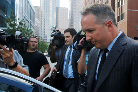 FILE PHOTO: Pharmacist and co-founder of the now-defunct New England Compounding Center Barry Cadden walks to his car after being sentenced to nine years in jail, beginning in August, for his role in a deadly U.S. meningitis outbreak in 2012, in Boston, Massachusetts, U.S. June 26, 2017. REUTERS/Brian Snyder/File Photo